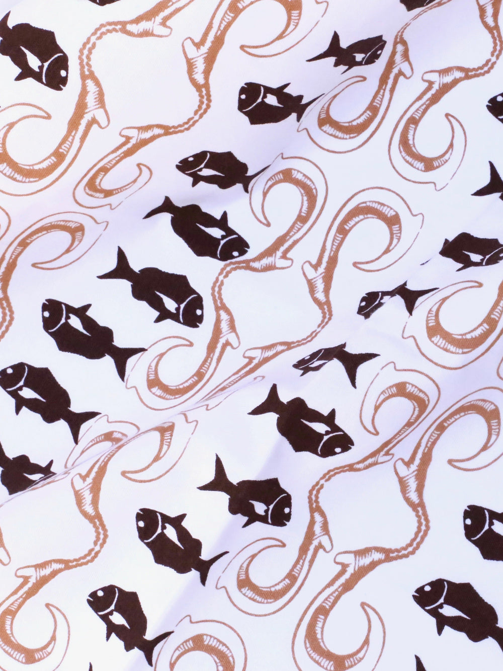 Pattern of black fish and brown tentacles on a light blue background
