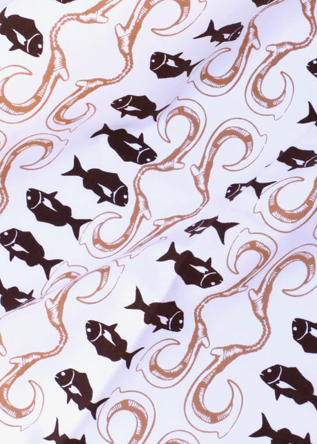 Pattern of black fish and brown tentacles on a light blue background