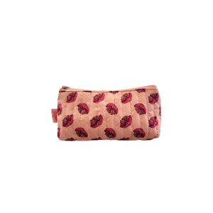 Small pink floral toilet bag with a white background.